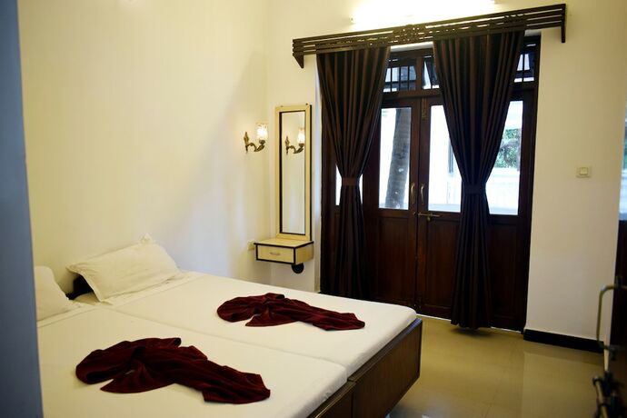 Imagen de la habitación del Hotel Naga Cottages. Foto 27