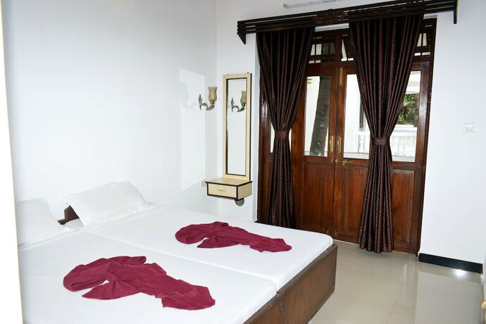 Imagen de la habitación del Hotel Naga Cottages. Foto 28