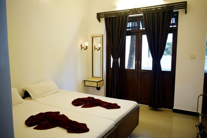 Imagen de la habitación del Hotel Naga Cottages. Foto 29