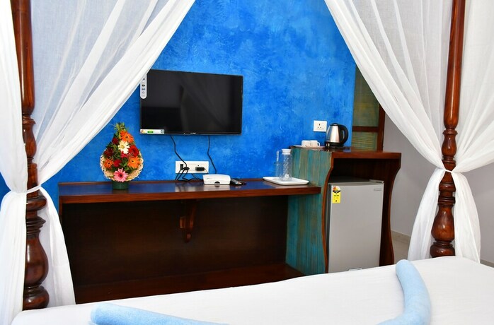 Imagen de la habitación del Hotel Naga Cottages. Foto 31