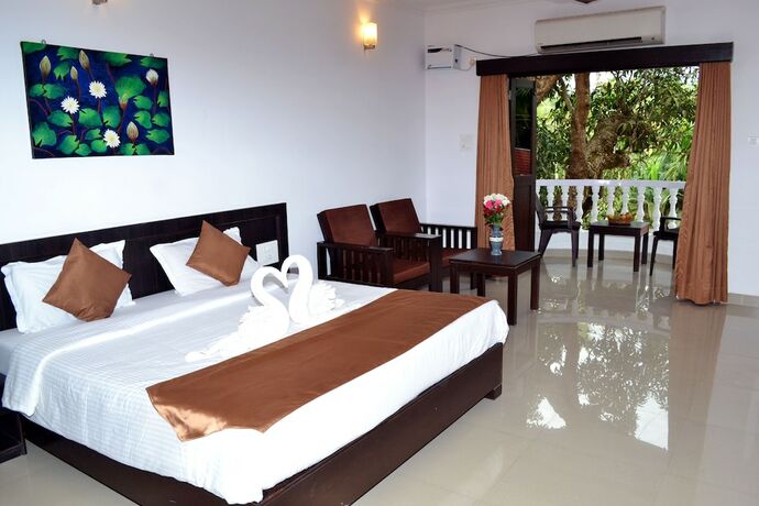 Imagen de la habitación del Hotel Naga Cottages. Foto 32