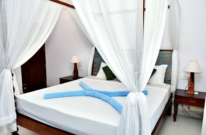 Imagen de la habitación del Hotel Naga Cottages. Foto 33