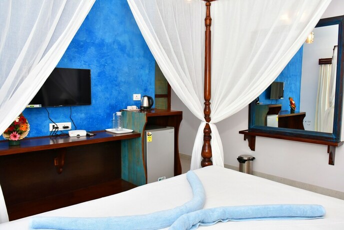 Imagen de la habitación del Hotel Naga Cottages. Foto 36