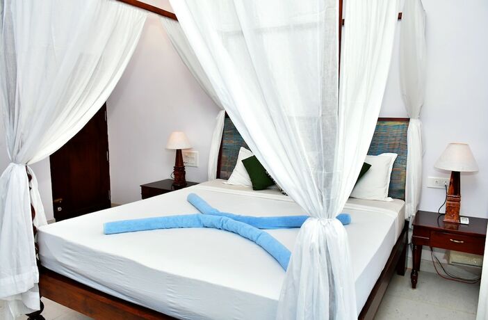 Imagen de la habitación del Hotel Naga Cottages. Foto 38