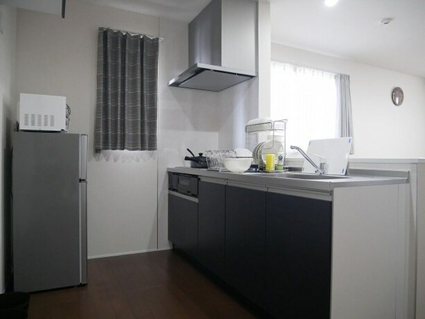 Imagen de la habitación del Hotel Nagayama Whole Apartment. Foto 16