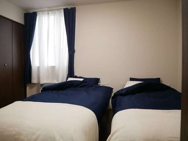 Imagen de la habitación del Hotel Nagayama Whole Apartment. Foto 18