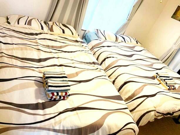 Imagen de la habitación del Hotel Naha Asahibashi Condominium Holiday. Foto 31