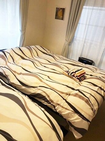 Imagen de la habitación del Hotel Naha Asahibashi Condominium Holiday. Foto 34