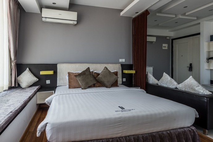 Imagen de la habitación del Hotel Naki Suites At Silvertown. Foto 8