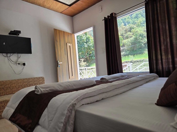 Imagen de la habitación del Hotel Namami Kedara Resort. Foto 8