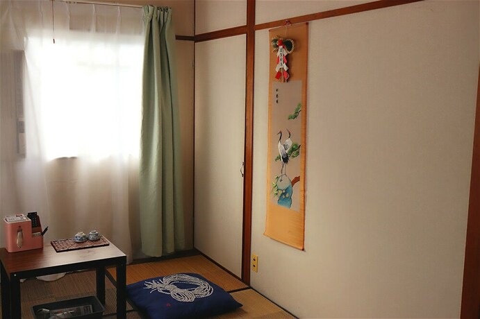 Imagen de la habitación del Hotel Namba Sunshine Apartment. Foto 15