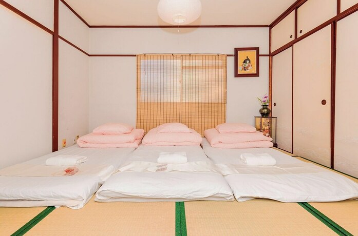 Imagen de la habitación del Hotel Namba Sunshine Apartment. Foto 19