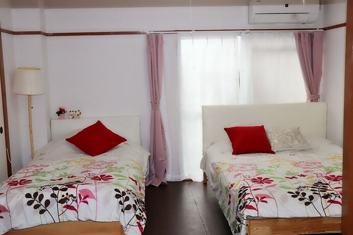 Imagen de la habitación del Hotel Namba Sunshine Apartment. Foto 23