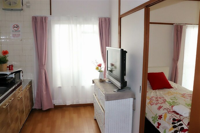 Imagen de la habitación del Hotel Namba Sunshine Apartment. Foto 24