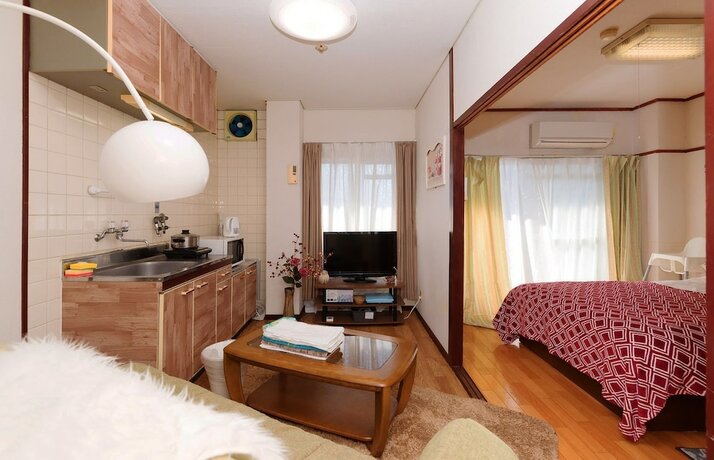 Imagen de la habitación del Hotel Namba Sunshine Apartment. Foto 28