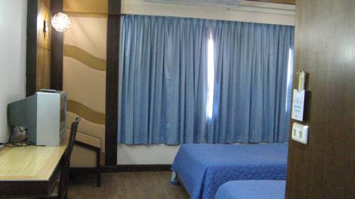 Imagen de la habitación del Hotel Nanchao. Foto 7