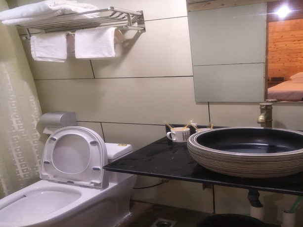 Imagen de la habitación del Hotel Nanjing Tulou Qingdelou Inn. Foto 10