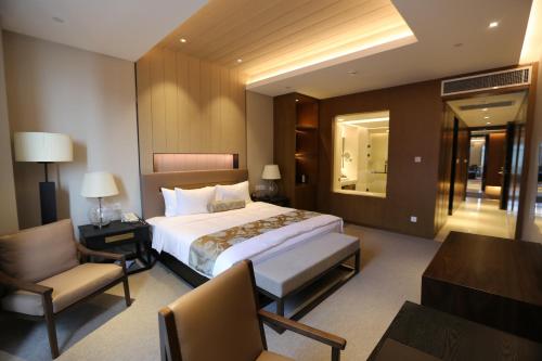 Imagen de la habitación del Hotel Nanjing University International Conference Center. Foto 16