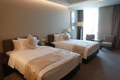 Imagen de la habitación del Hotel Nanjing University International Conference Center. Foto 18