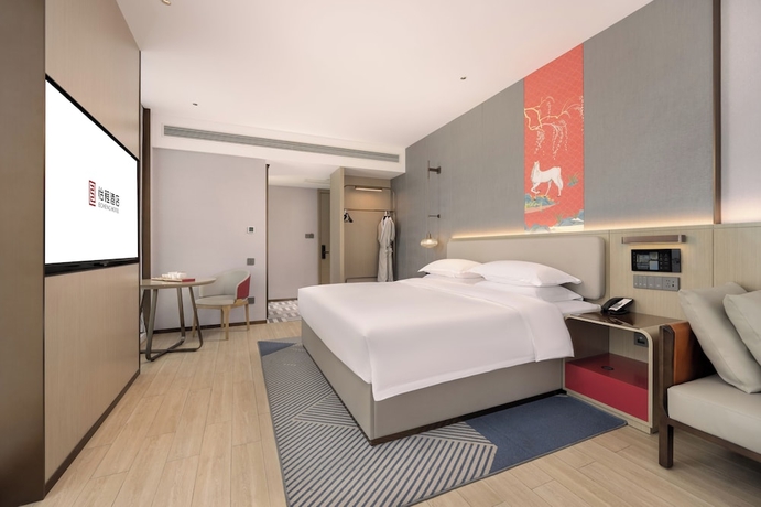 Imagen de la habitación del Hotel Nanning Huafengcheng ECHENG. Foto 11