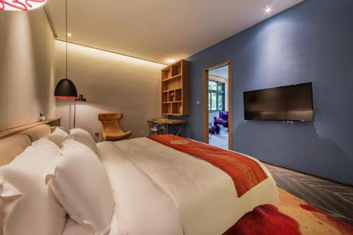 Imagen de la habitación del Hotel Nanxianglou Art. Foto 19