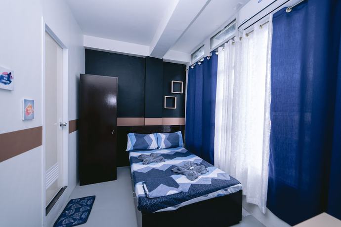 Imagen de la habitación del Hotel Napsule Suites Davao. Foto 9