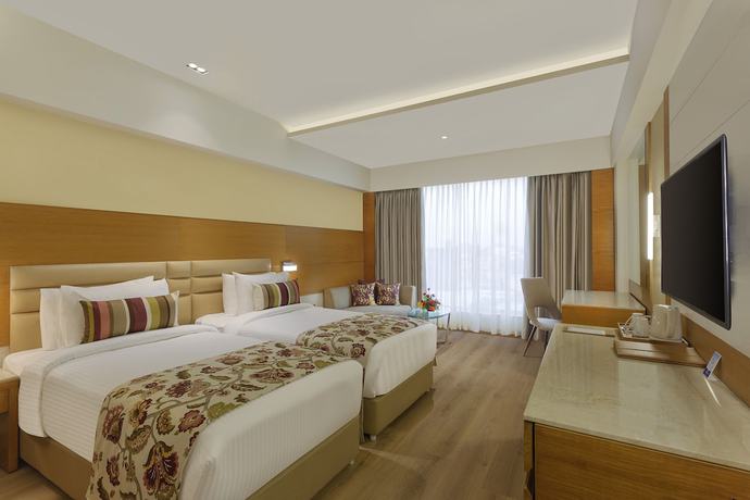 Imagen de la habitación del Hotel Nataraj Sarovar Portico Jhansi. Foto 8