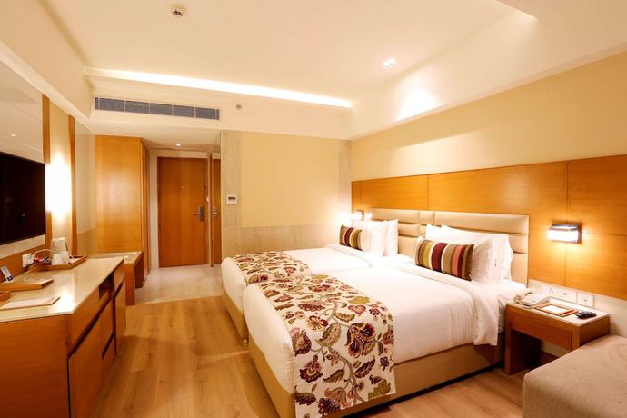 Imagen de la habitación del Hotel Nataraj Sarovar Portico Jhansi. Foto 9