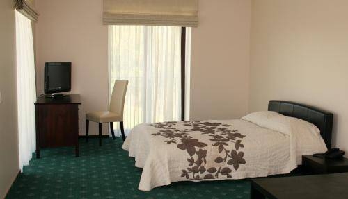 Imagen de la habitación del Hotel National Golf Resort. Foto 6