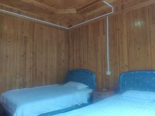 Imagen de la habitación del Hotel Natural Lodge Homestay. Foto 19