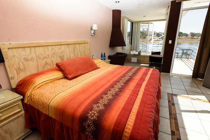 Imagen de la habitación del Hotel Natural Suites- cerca de Africam Safari Valsequillo Puebla. Foto 3