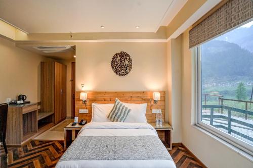 Imagen de la habitación del Hotel NatureVilas Sarovar Portico Manali. Foto 19