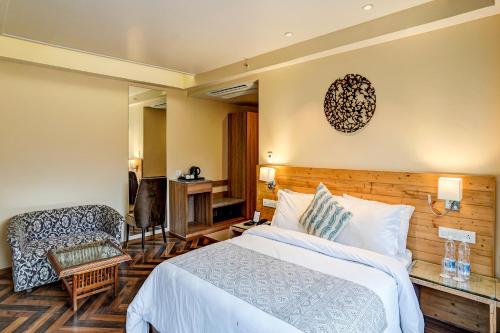 Imagen de la habitación del Hotel NatureVilas Sarovar Portico Manali. Foto 20