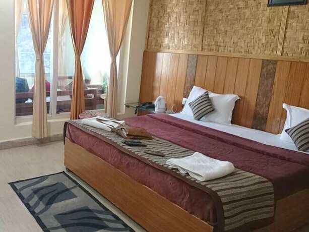 Imagen de la habitación del Hotel Nature's Valley Resort Kausani. Foto 11