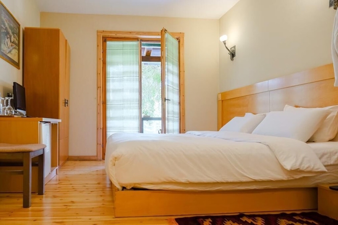 Imagen de la habitación del Hotel Natyral Razma Resort. Foto 16