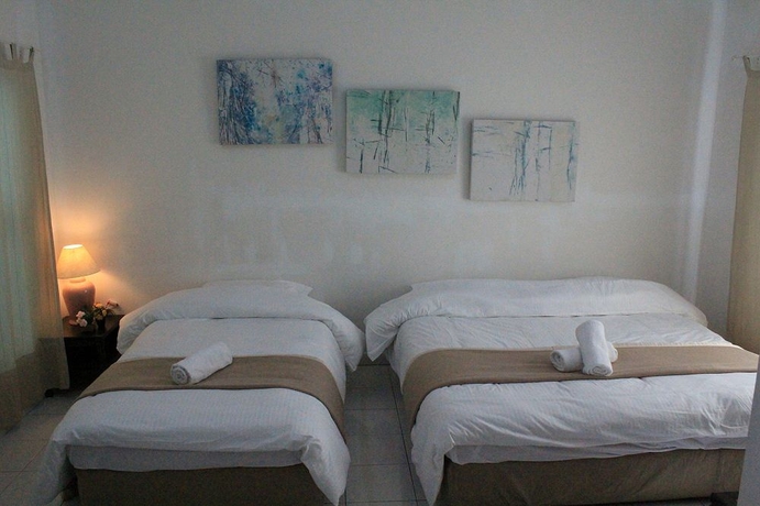 Imagen de la habitación del Hotel Nautilus Bay Home Inn. Foto 9