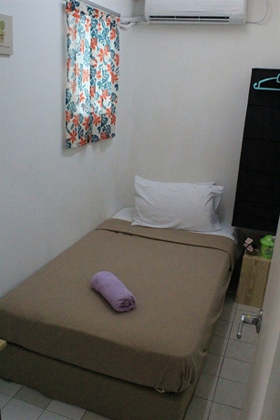 Imagen de la habitación del Hotel Nautilus Bay Home Inn. Foto 10