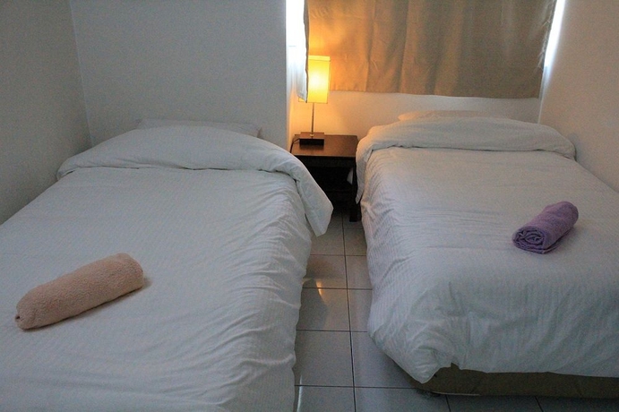 Imagen de la habitación del Hotel Nautilus Bay Home Inn. Foto 12