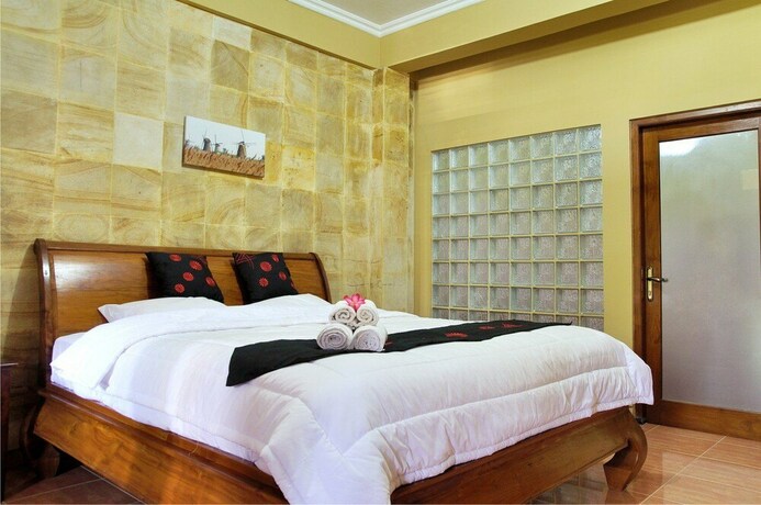 Imagen de la habitación del Hotel Ndalem Bantul. Foto 17