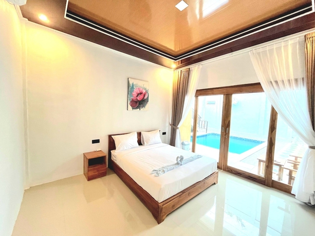 Imagen de la habitación del Hotel NeNa Eat and Sleep Kuta. Foto 3