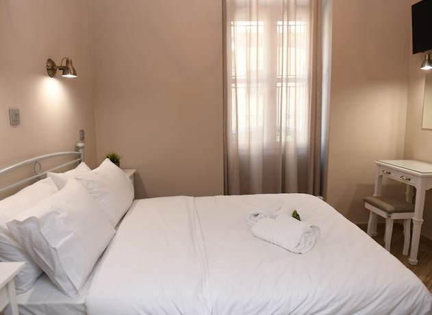 Imagen de la habitación del Hotel Neapolis 1897 Boutique Luxury Rooms. Foto 3