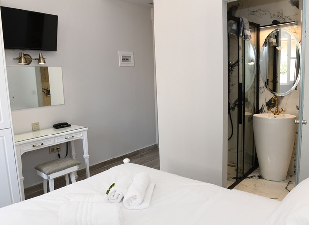 Imagen de la habitación del Hotel Neapolis 1897 Boutique Luxury Rooms. Foto 9