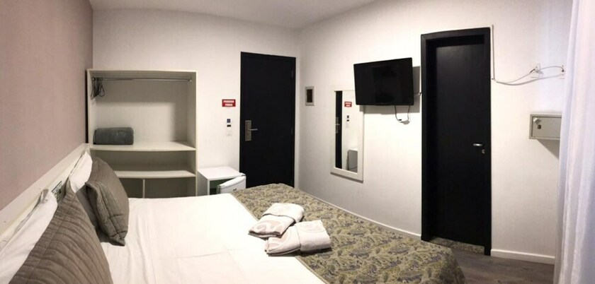 Imagen de la habitación del Hotel Negrini. Foto 17