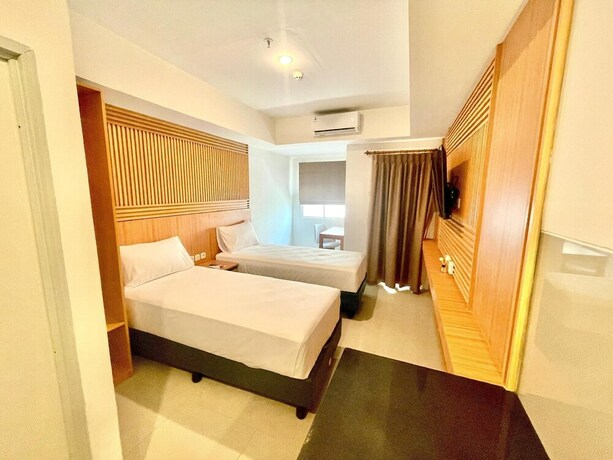 Imagen de la habitación del Hotel Nemuru Ciputat. Foto 18