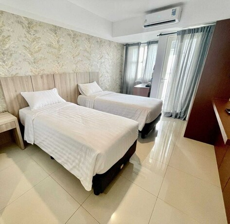 Imagen de la habitación del Hotel Nemuru Ciputat. Foto 26