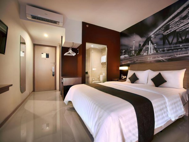 Imagen de la habitación del Hotel Neo Candi Simpang Lima - Semarang By Aston. Foto 5