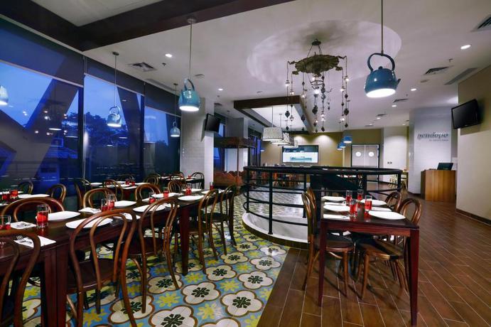 Imagen del bar/restaurante del Hotel Neo+ Kebayoran Jakarta By Aston. Foto 8