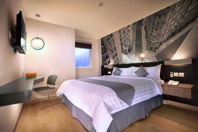 Imagen de la habitación del Hotel Neo Mangga Dua By Aston. Foto 7