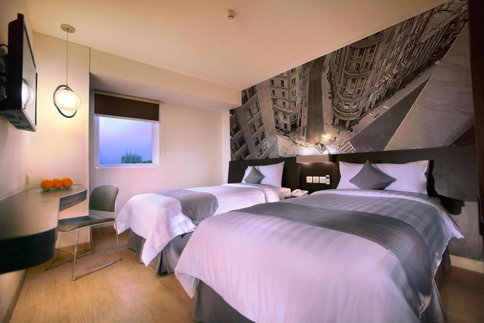 Imagen de la habitación del Hotel Neo Mangga Dua By Aston. Foto 9