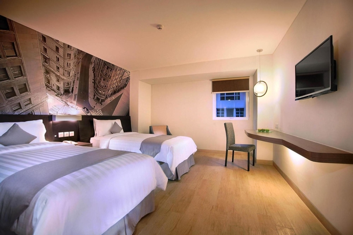 Imagen de la habitación del Hotel Neo Mangga Dua By Aston. Foto 10